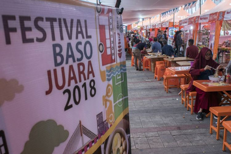 Festival Baso Juara 2018 - Organized dining area with orange tables and festival banner